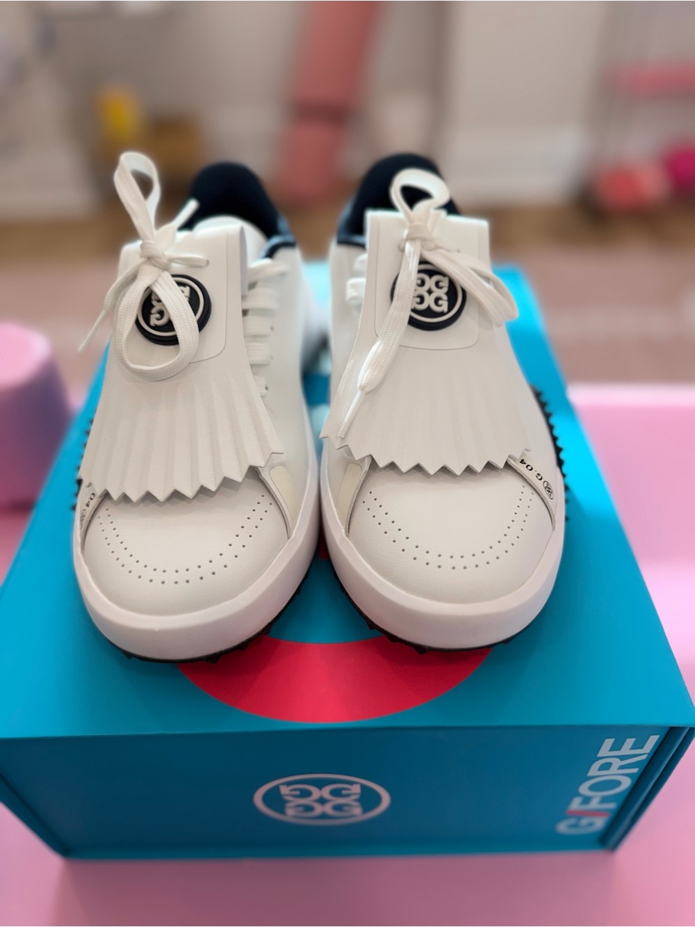 G/FORE Women’s G.112 Kiltie spikeless golf shoes in white with navy 8.5